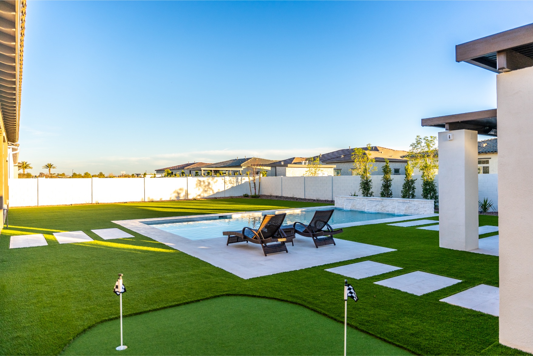 JNK Landscaping and Pools with turf, pool and pathway